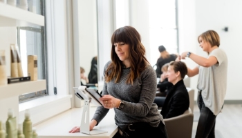 Business owner reviewing data on a tablet