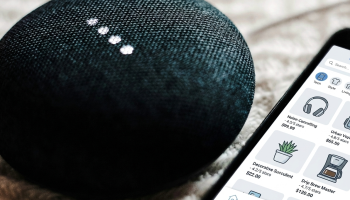Amazon Alexa next to a smartphone ecommerce app